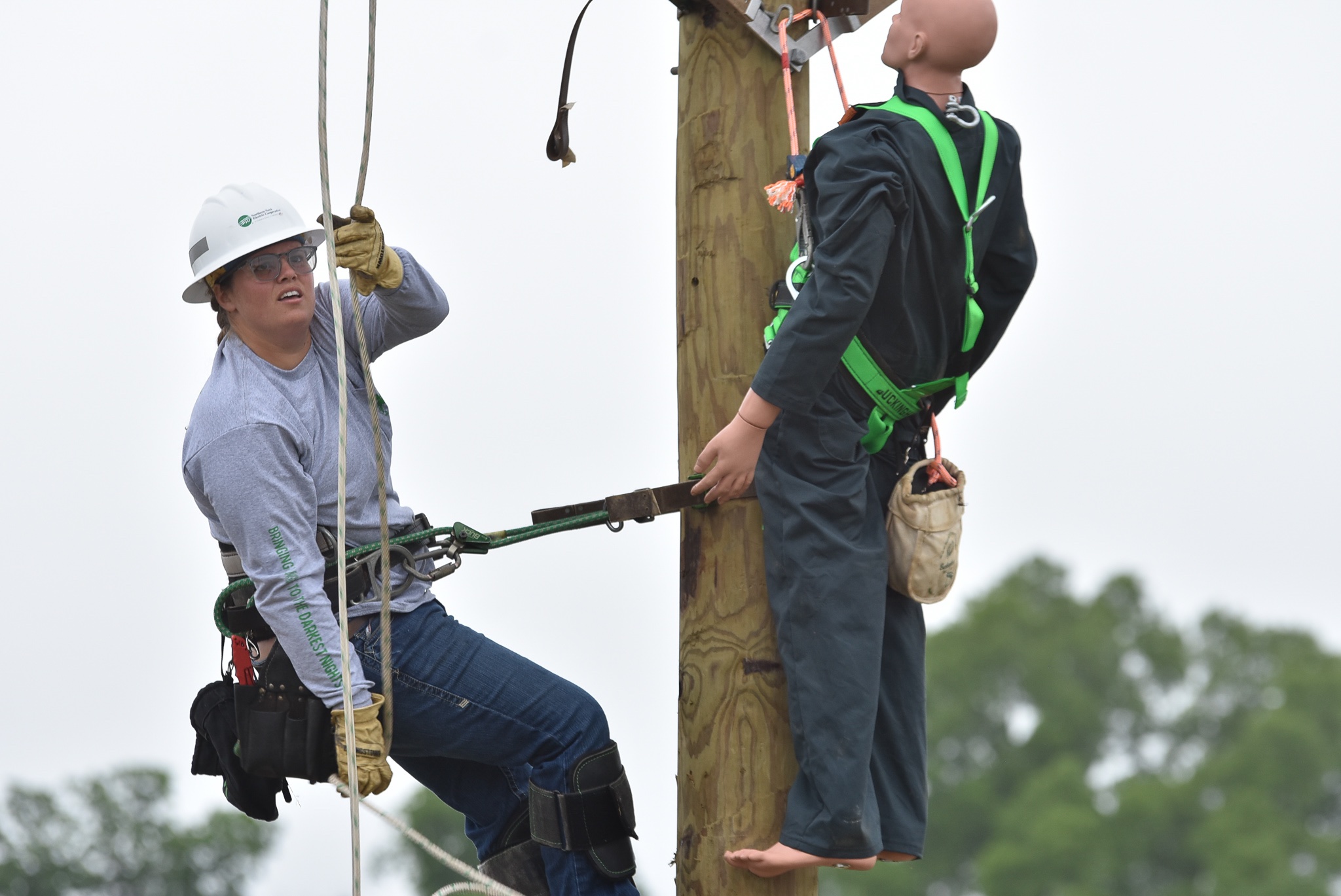 The only female competitor at this year's Gaff-n-Go Lineworker’s Rodeo, Gena Boarman with Northern Neck Electric Cooperative, completes the hurt-man rescue event.