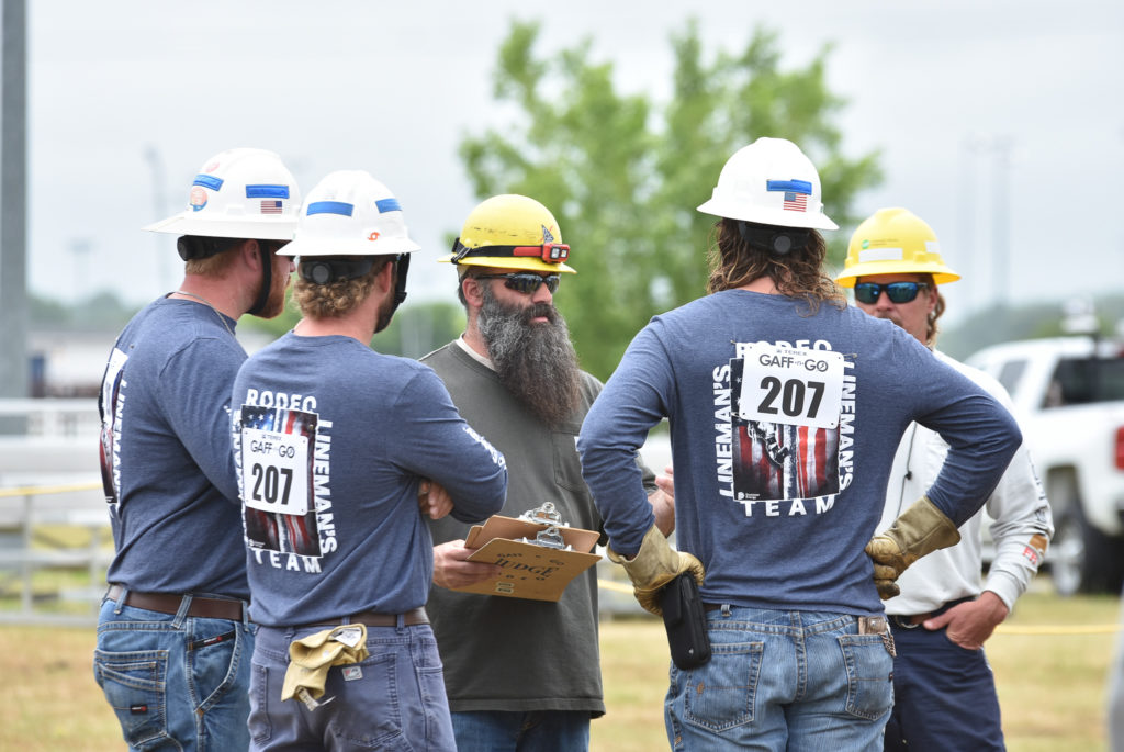 A Dominion Energy team getting ready to compete in the Equipment Operator’s Rodeo competition at the 2022 Gaff-n-Go Lineworker’s Rodeo.