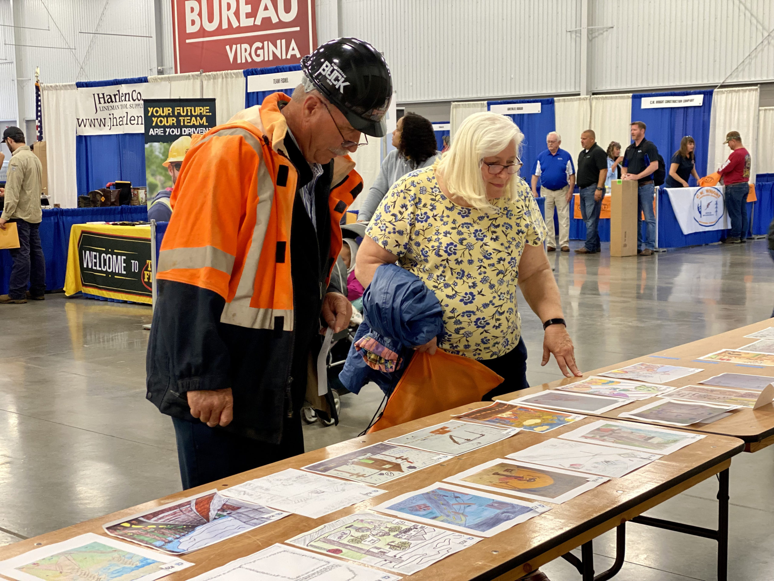 C.T. Bryant, a retired Central Virginia Electric Cooperative manager who plays a lead role in organizing the annual Gaff-n-Go event, takes a moment to vote in the Cooperative Living Youth Art Contest.