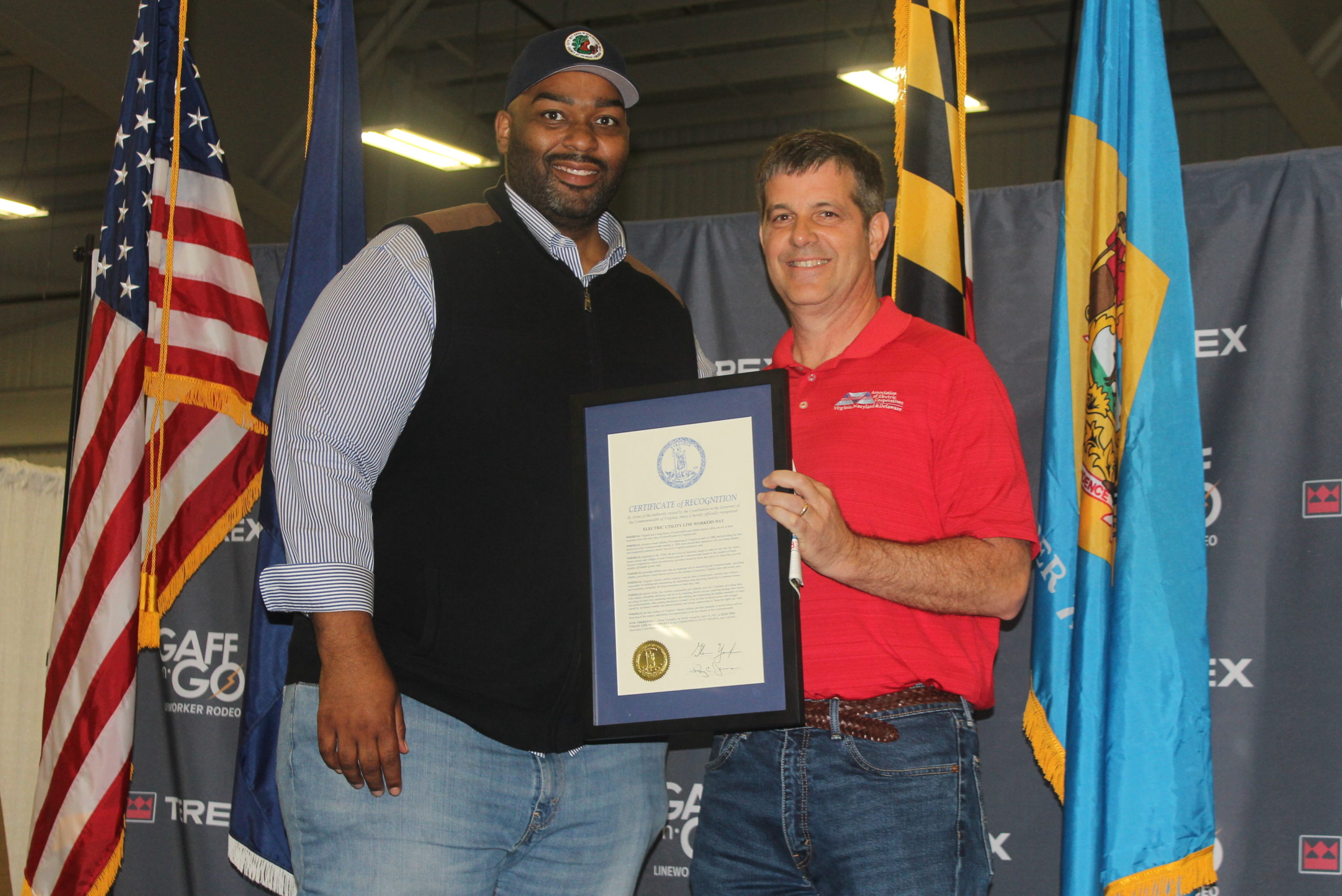 During the opening ceremony, Delegate Lamont Bagby presents the Governor’s Proclamation of Utility Lineworker Day in Virginia to Brian Mosier, President & CEO of VMDAEC.